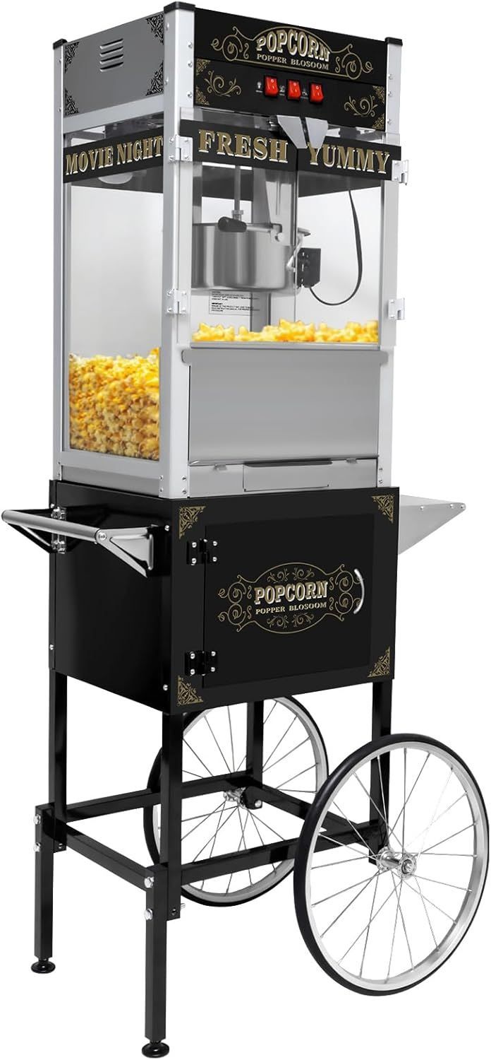 A popcorn machine with wheels is sitting on a cart.