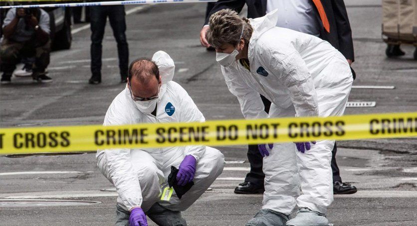 Crime scene with two official examining the site