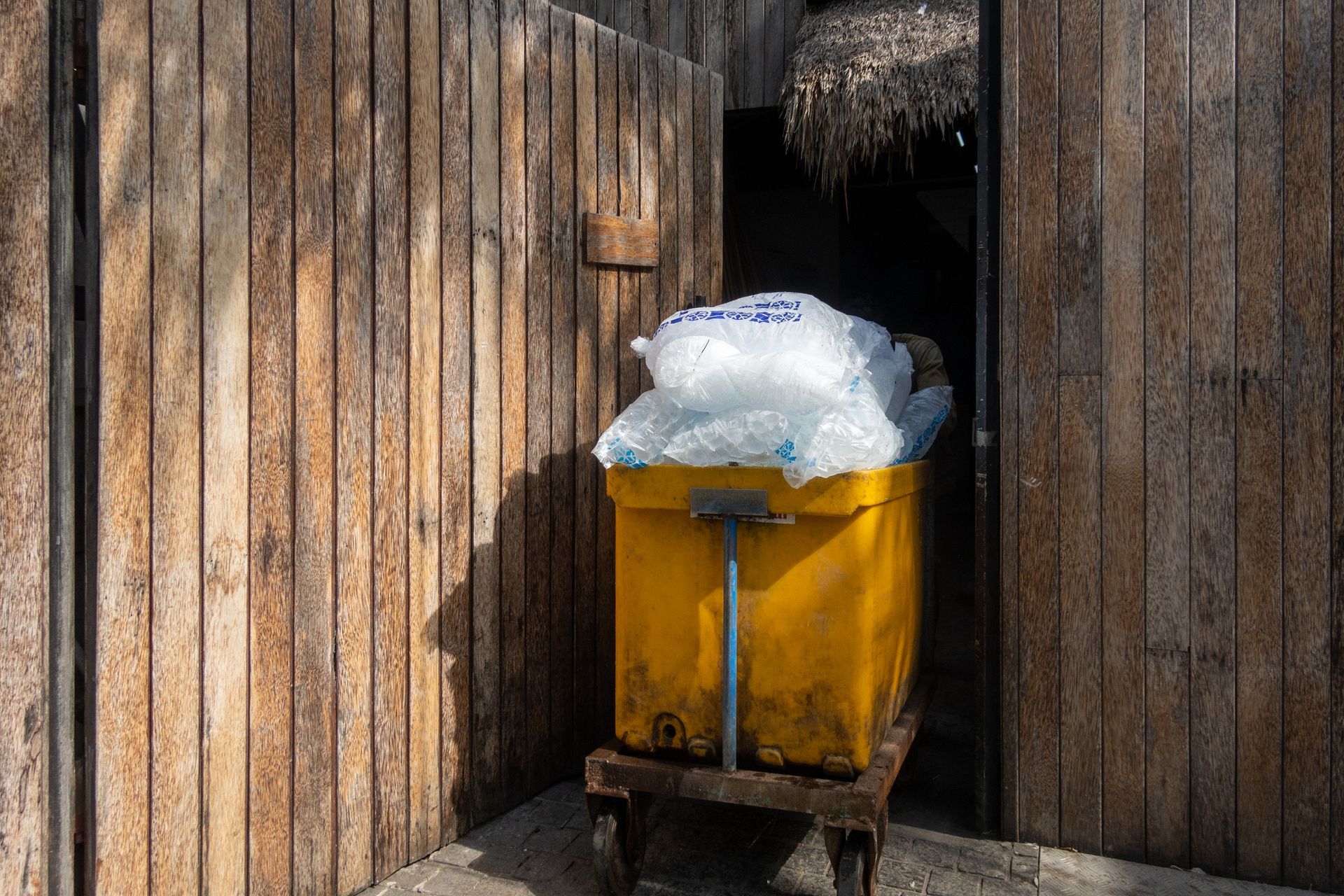 A trolley carrying bags of ice with the ice symbol. A trolley carrying bags of ice with the ice symbol.