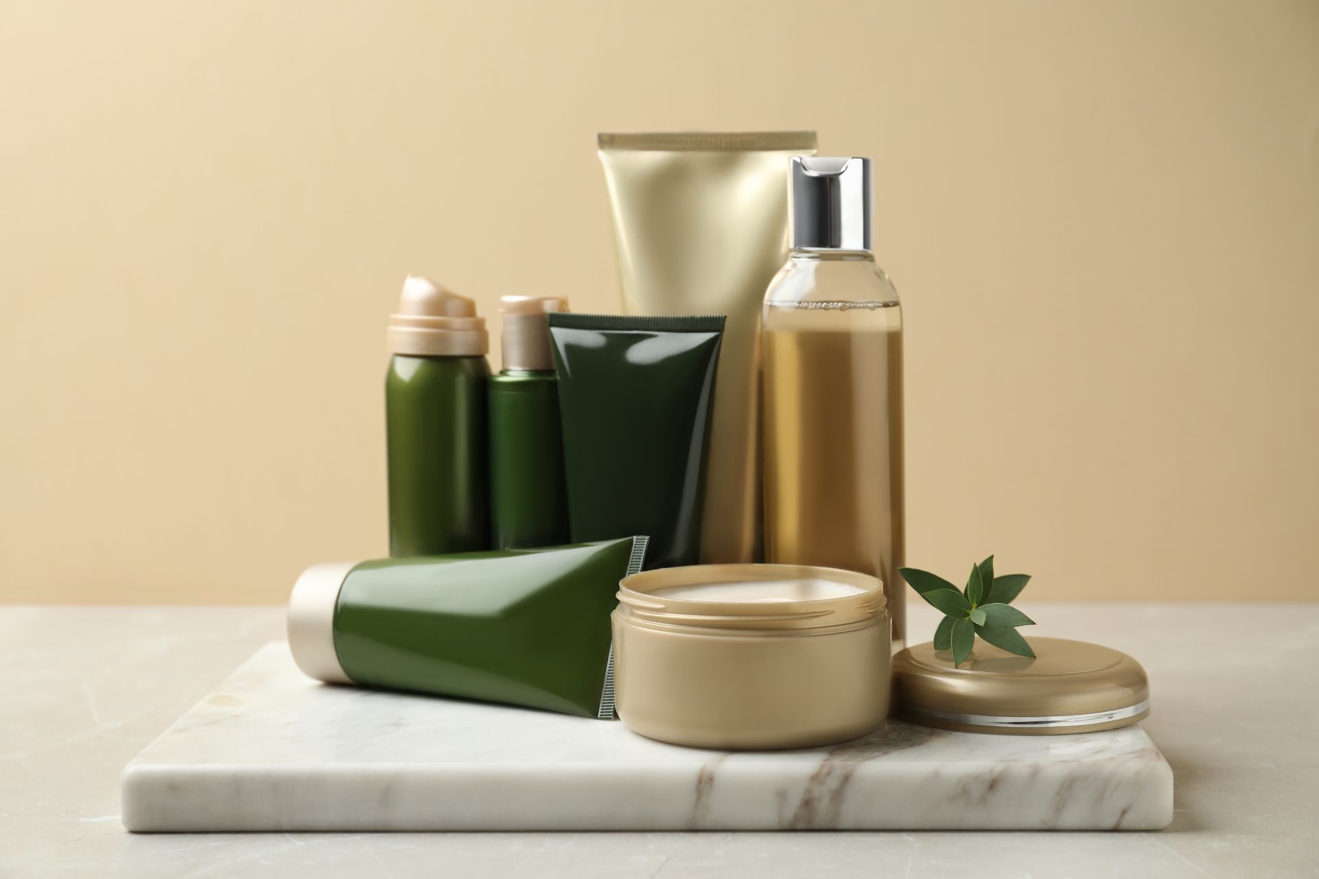 There are many different types of cosmetics on the table.