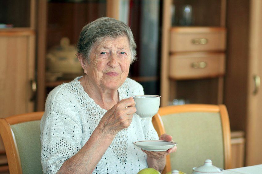 Elder lady drinking tea