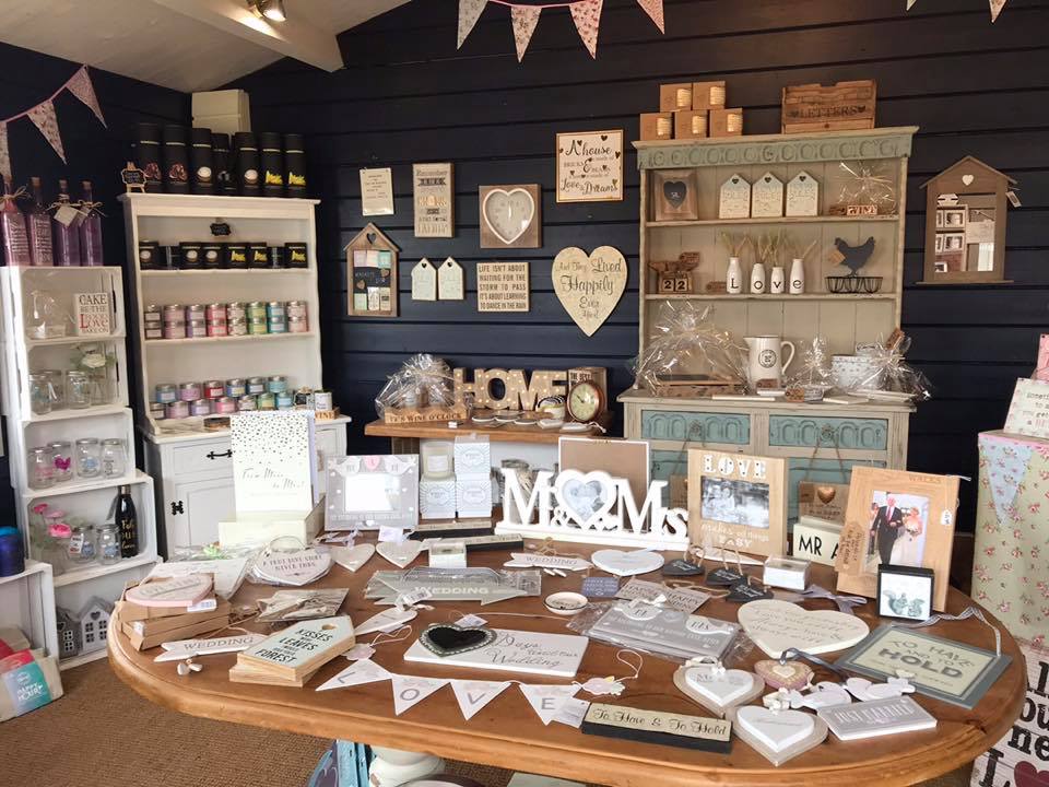 A room filled with lots of decorations and a table with a sign that says mr. and mrs.