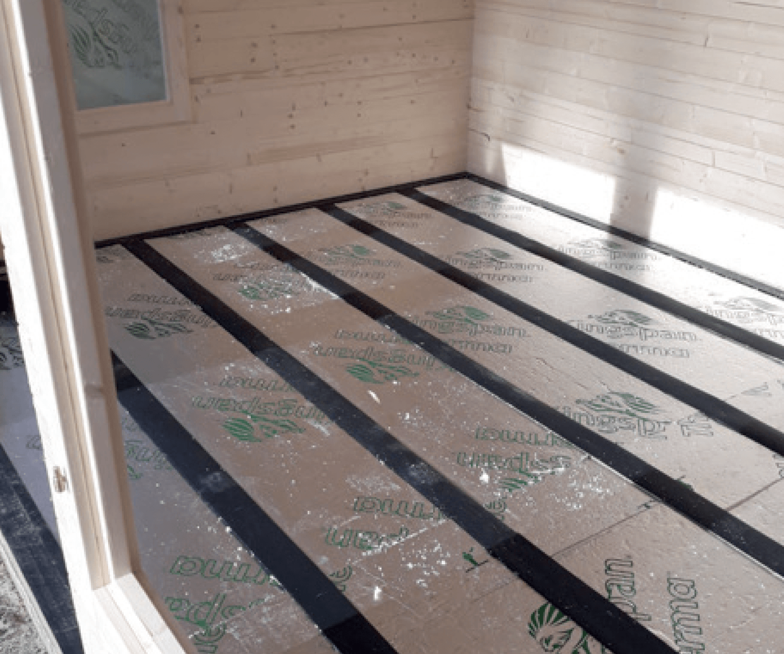 A room with a wooden floor that says dunlop on it