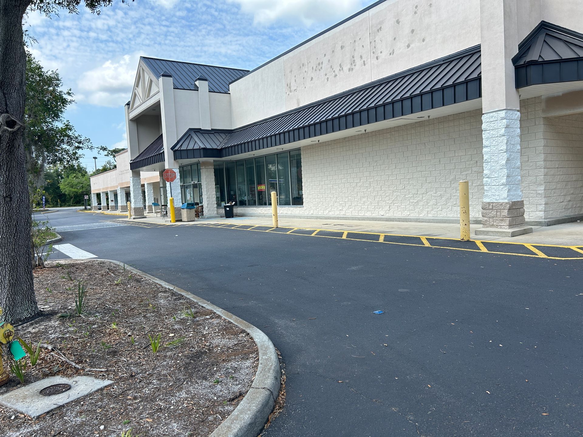 A large building with a parking lot in front of it