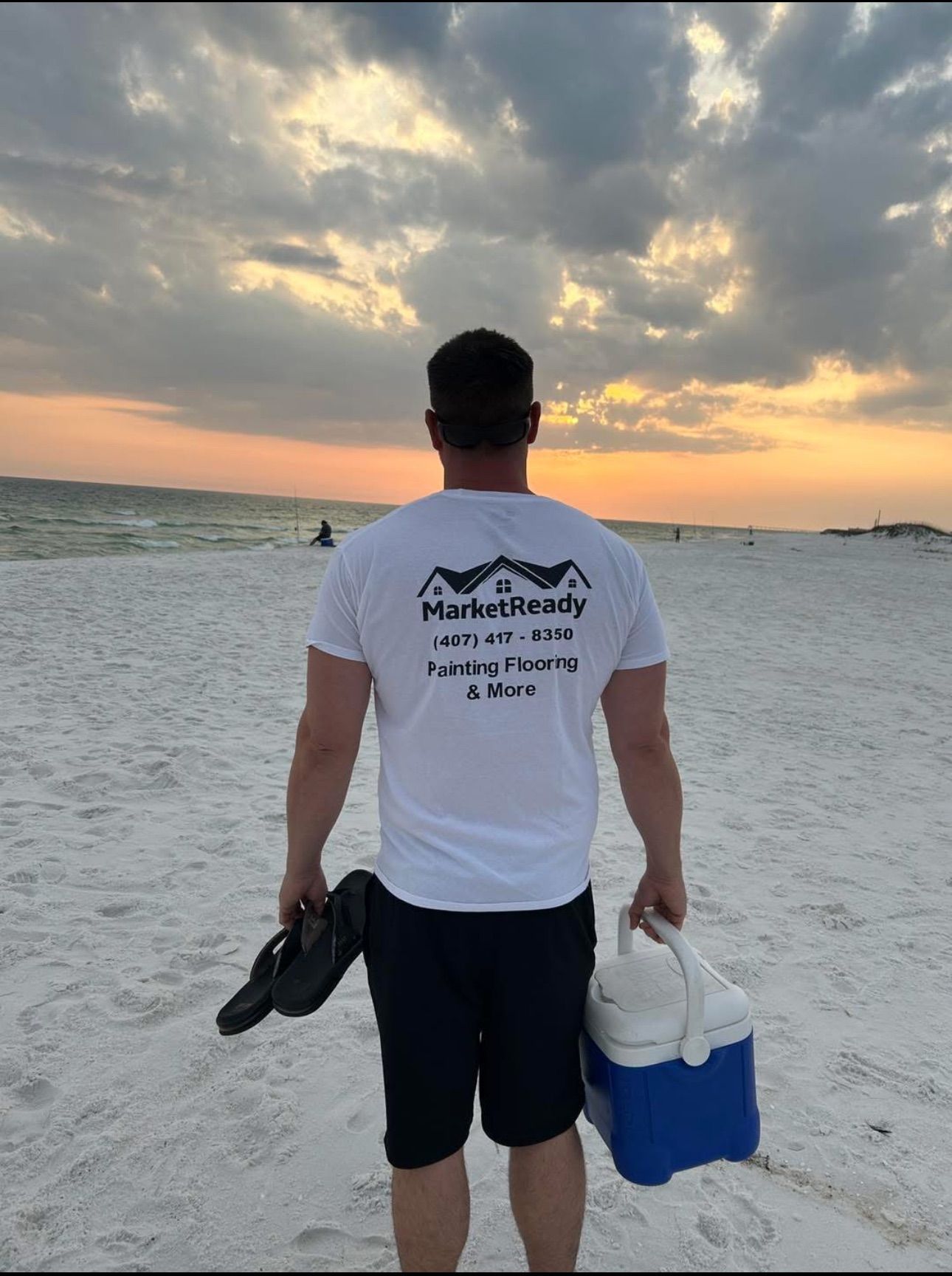 A man is jumping off a dock into the water
