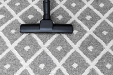 black vacuum in the carpet