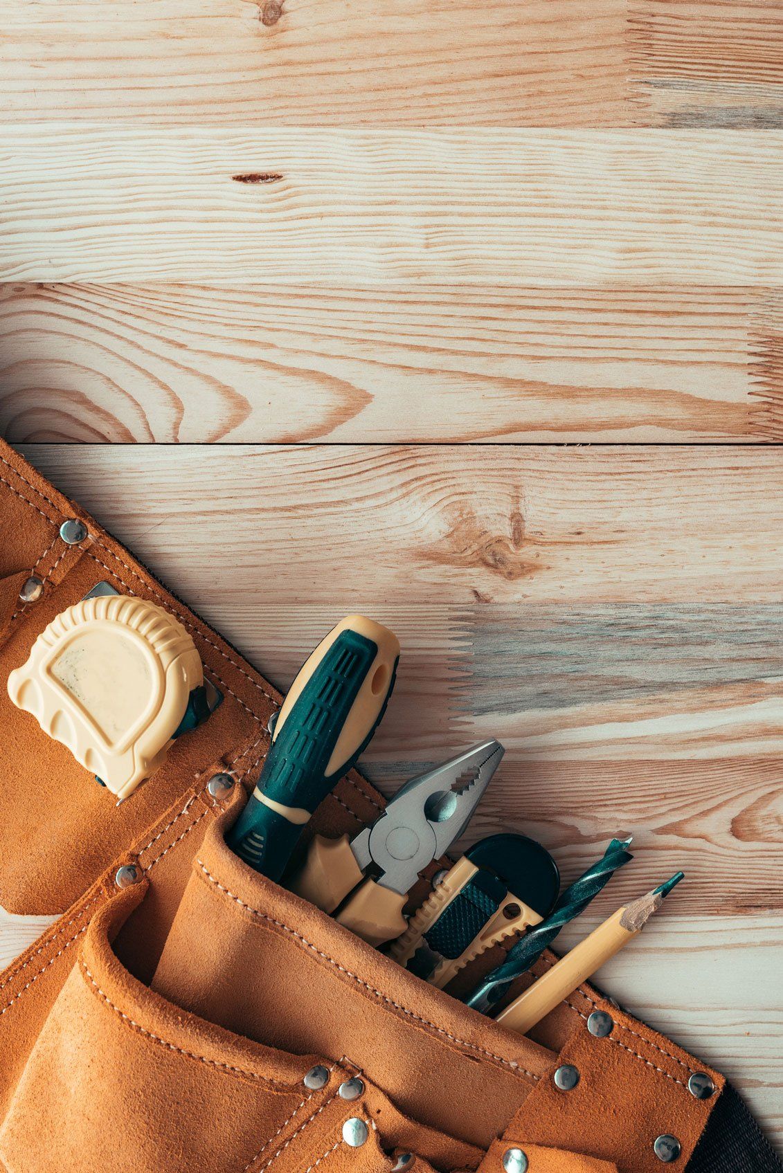 Handyman — Carpentry Tool Belt on Woodwork in Davenport, IA
