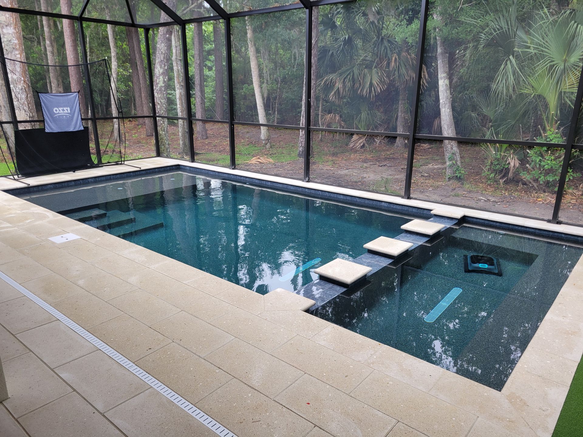 Back Yard With Two Chairs And Swimming Pool — Jacksonville Beach, FL — Taurus Pools