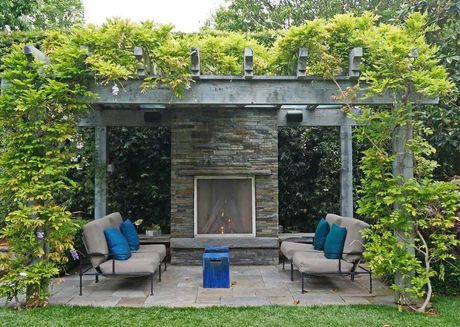 outdoor fireplace with pergola in Rochester NY