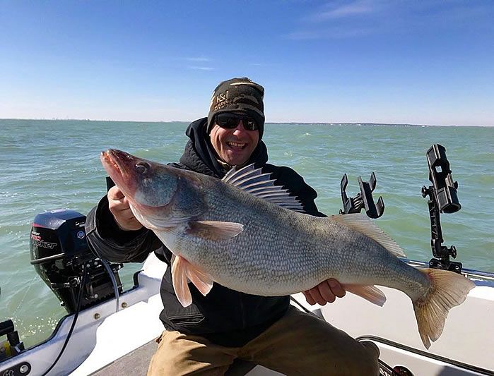 Happy angler with a large walleye