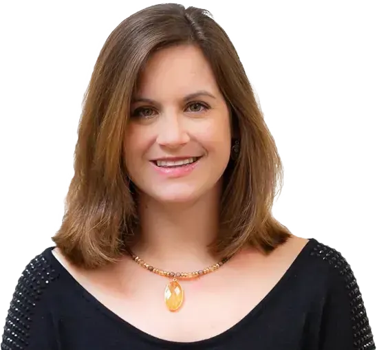 A woman wearing a black shirt and a necklace smiles for the camera