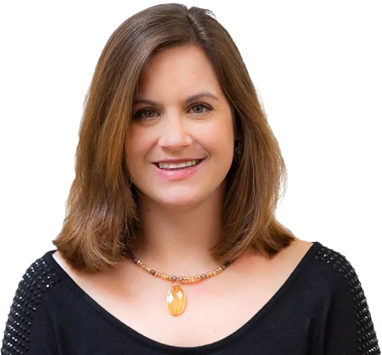 A woman wearing a black shirt and a necklace smiles for the camera