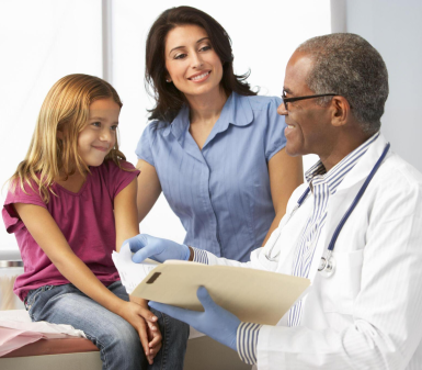 doctor listening to a child's heartbeat