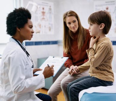 female soccer player receiving an exam