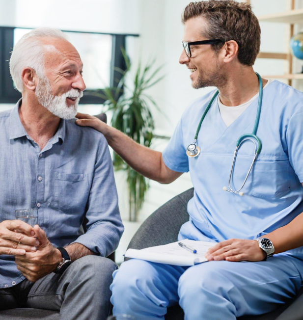 A doctor is talking to an older man in a chair