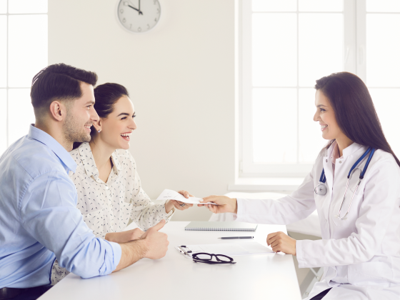 couple talking with a doctor