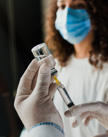 needle pulling medicine from a vial 