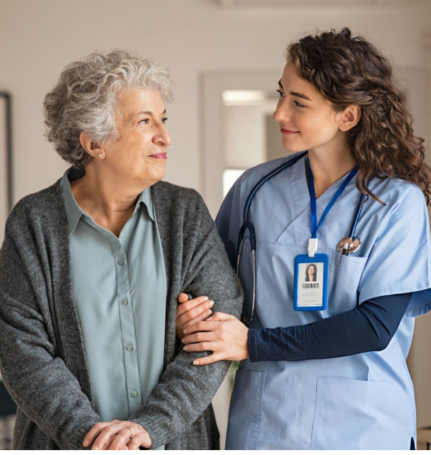 A nurse is holding the arm of an older woman