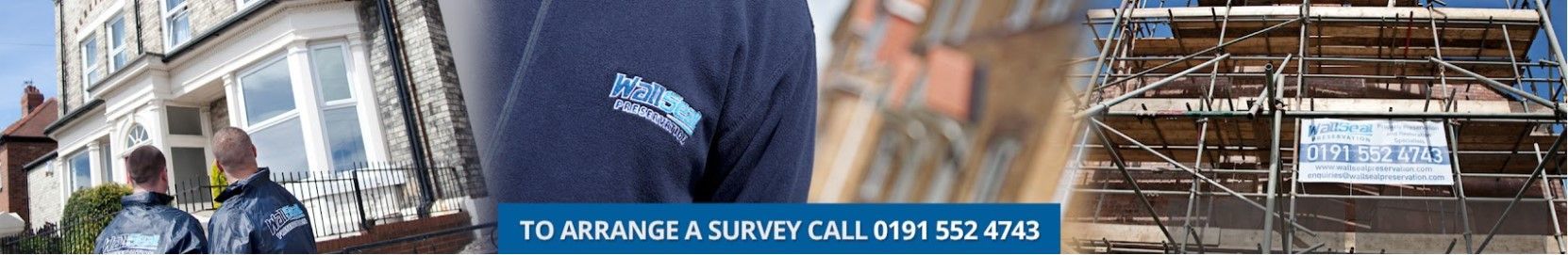 A man in a blue shirt is standing in front of a building.