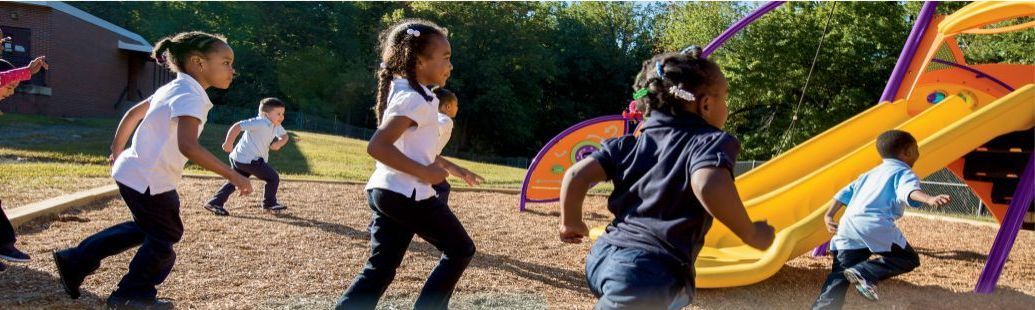 A group of children are playing in a playground.