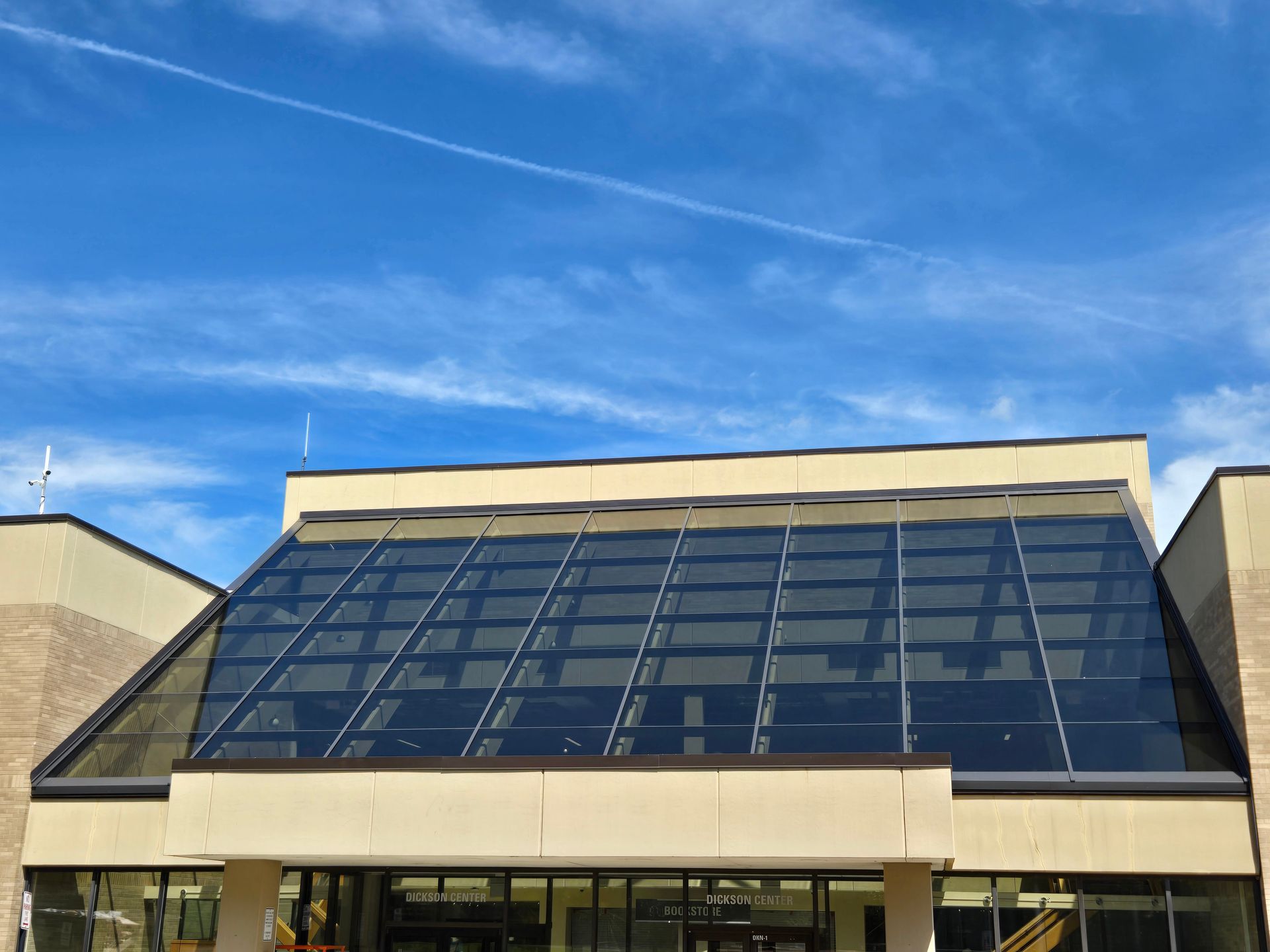 Contemporary Chicago building featuring a glass facade and skylight design