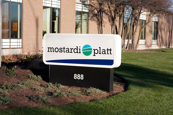 A Mostardi Platt Sign in Front of a Building
