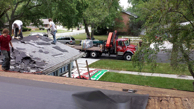 Three NSS Exteriors Repairmen Fixing a House Roof
