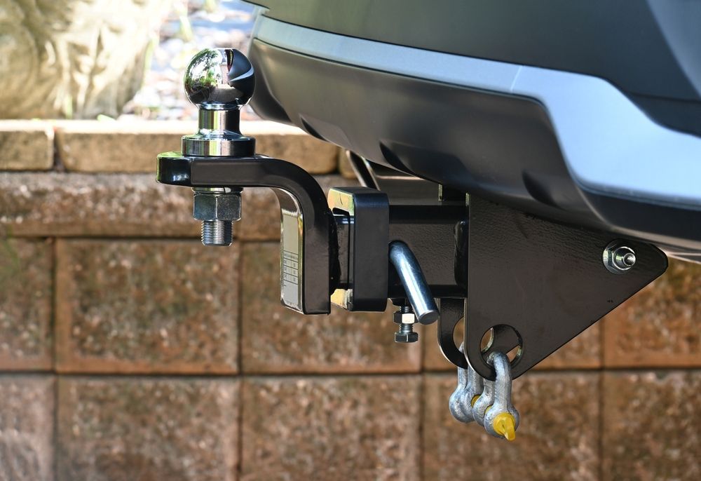 A Trailer Hitch is Attached to the Back of a Car — Mick Dunn Motor Repairs in Mackay, QLD