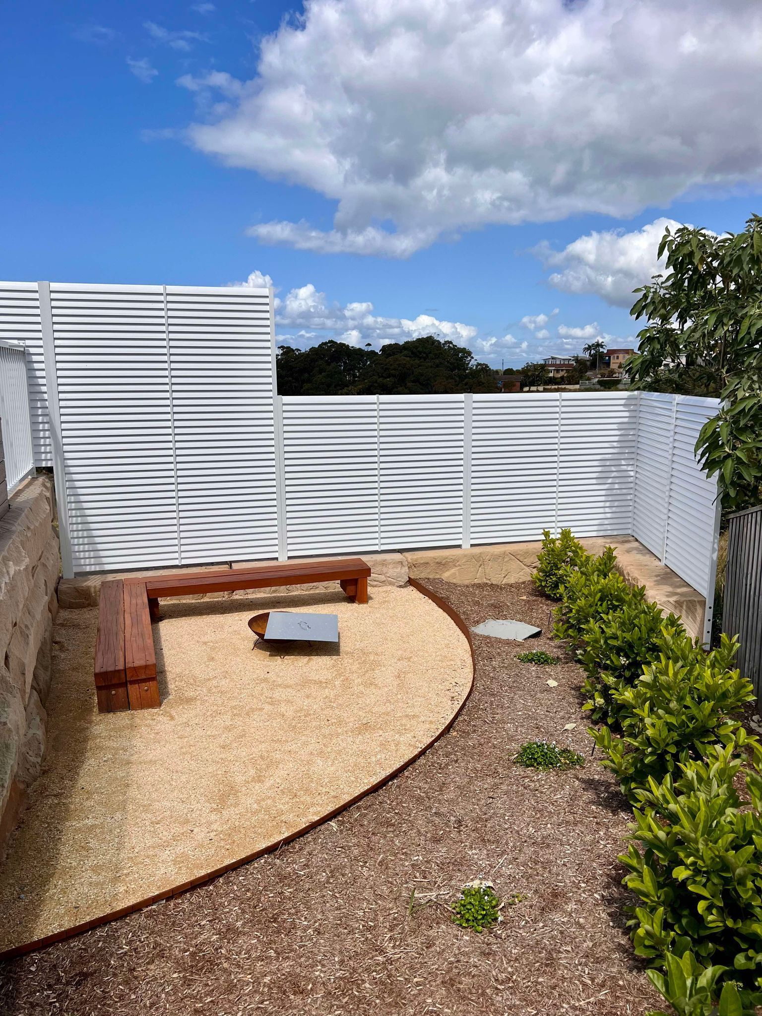 A Large Swimming Pool Surrounded By A Glass Fence In A Backyard — Glass Pool Fencing Australia in Old Bar, NSW