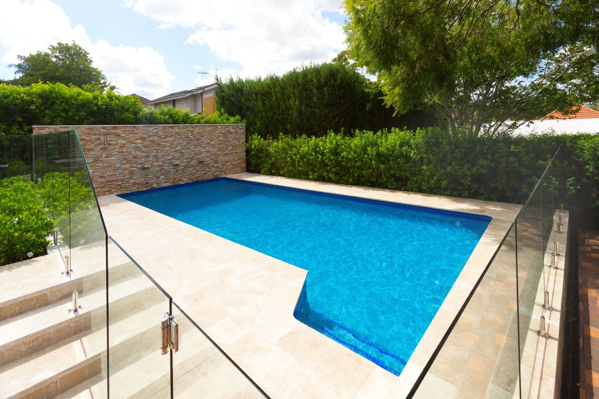 A Rectangular Swimming Pool with Bright Blue Water — Coastline Glass Pool Fencing in Old Bar, NSW