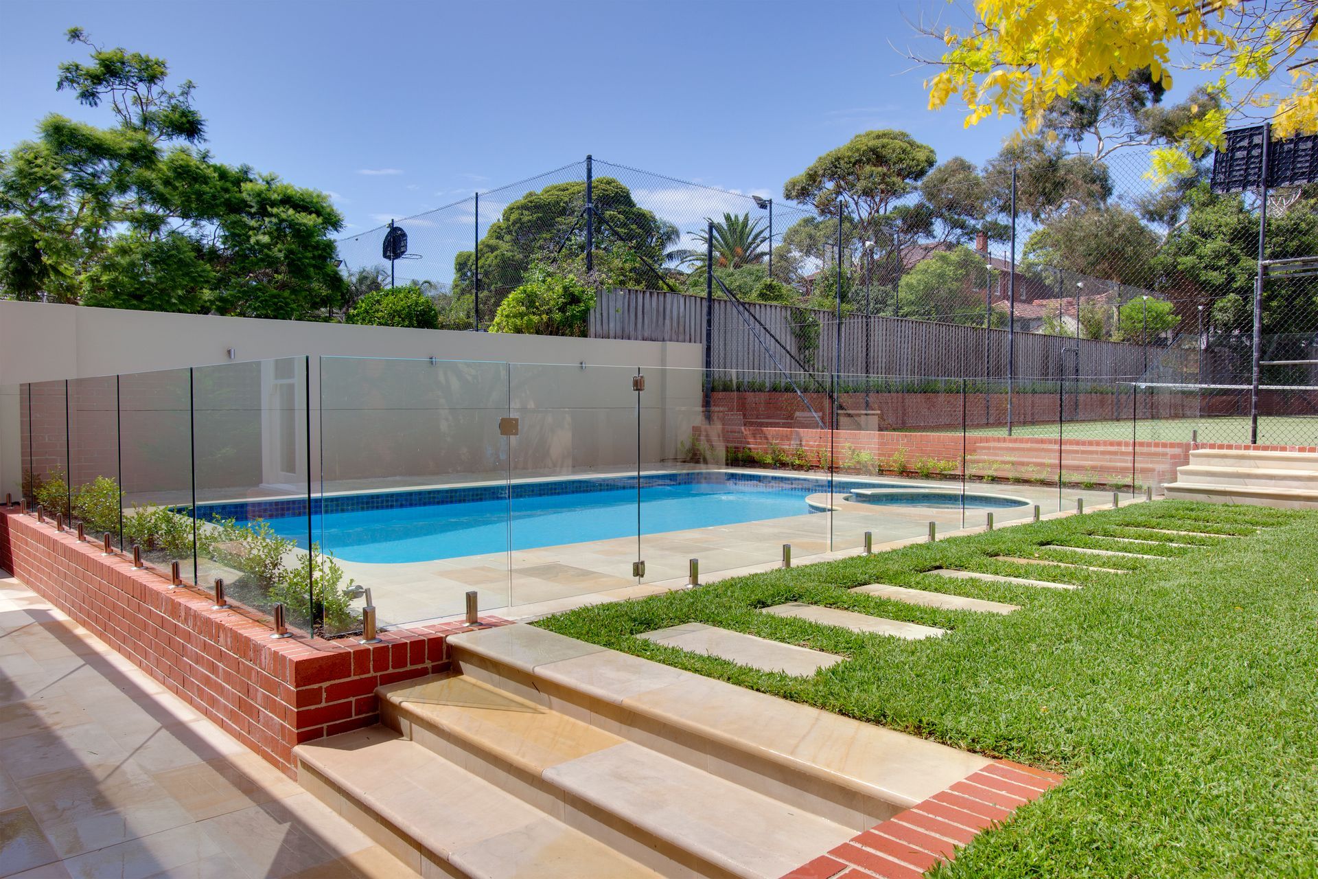 A Rectangular Swimming Pool Surrounded by A Glass Fence — Coastline Glass Pool Fencing in Old Bar, NSW