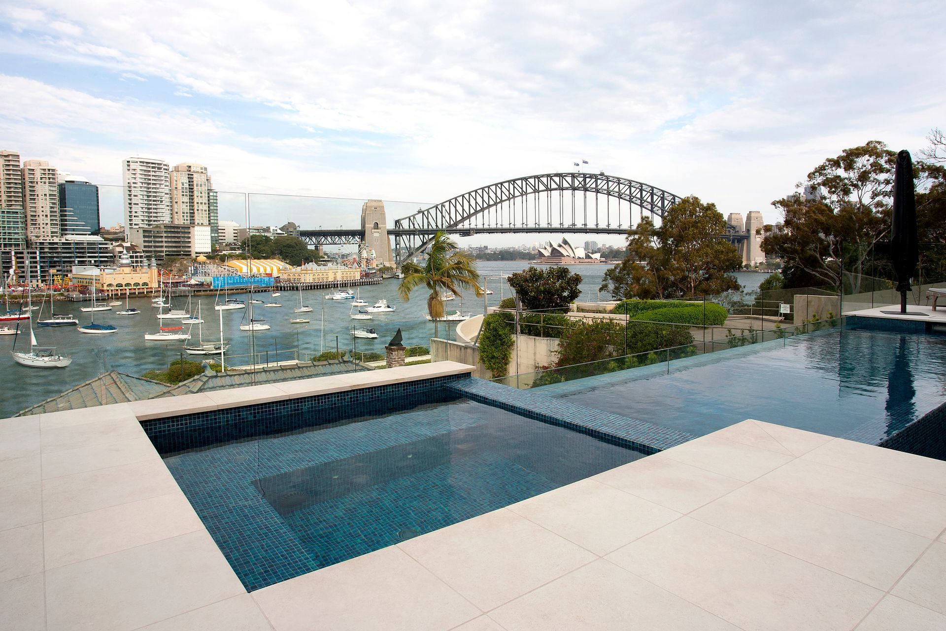 An Infinity Pool Overlooking Sydney Harbour — Coastline Glass Pool Fencing in Old Bar, NSW
