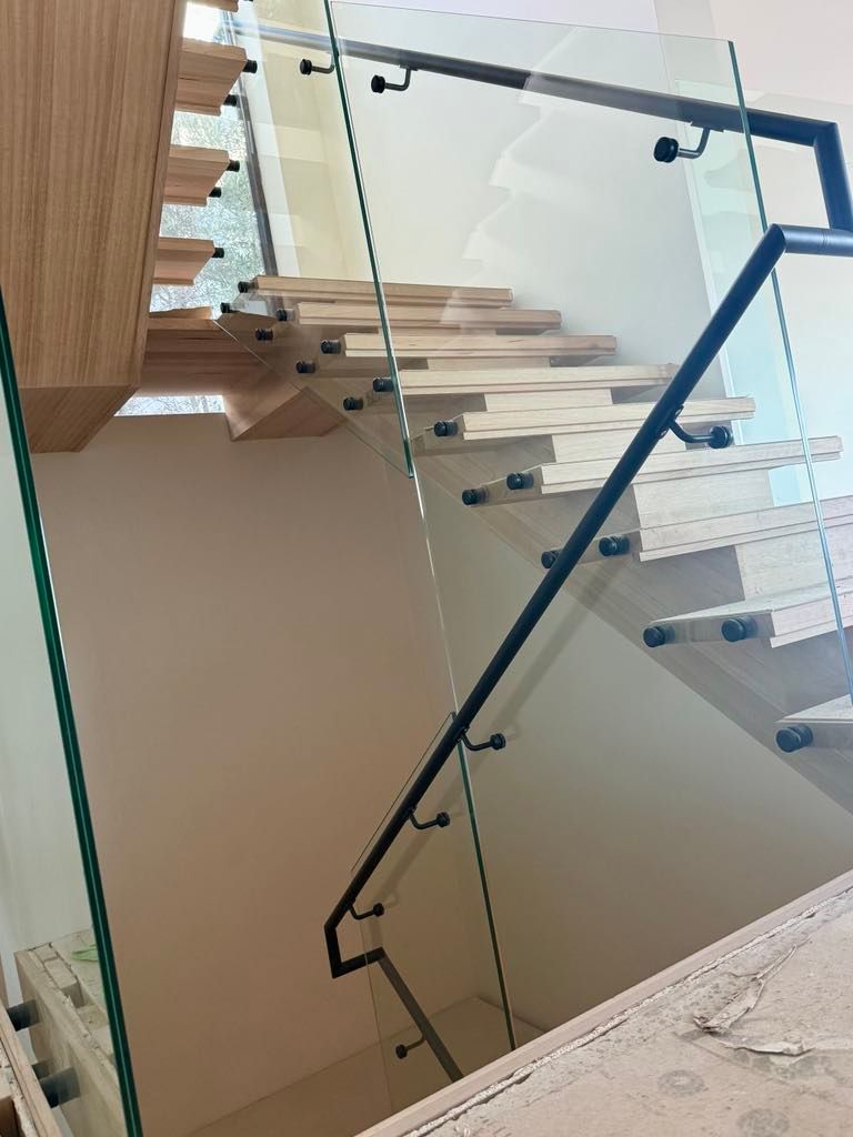 A Modern Staircase with Light Wood Floating Steps — Coastline Glass Pool Fencing in Old Bar, NSW