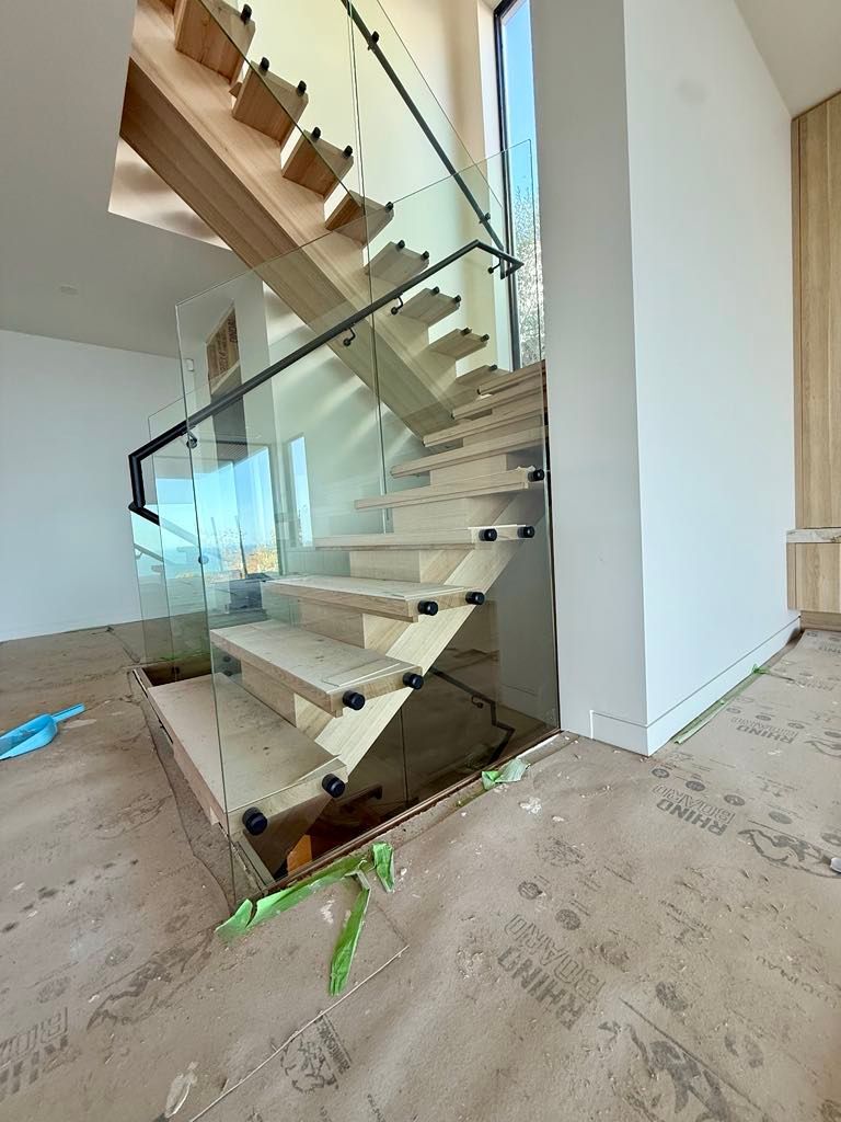 A Modern Staircase with Light Wood Treads — Coastline Glass Pool Fencing in Old Bar, NSW