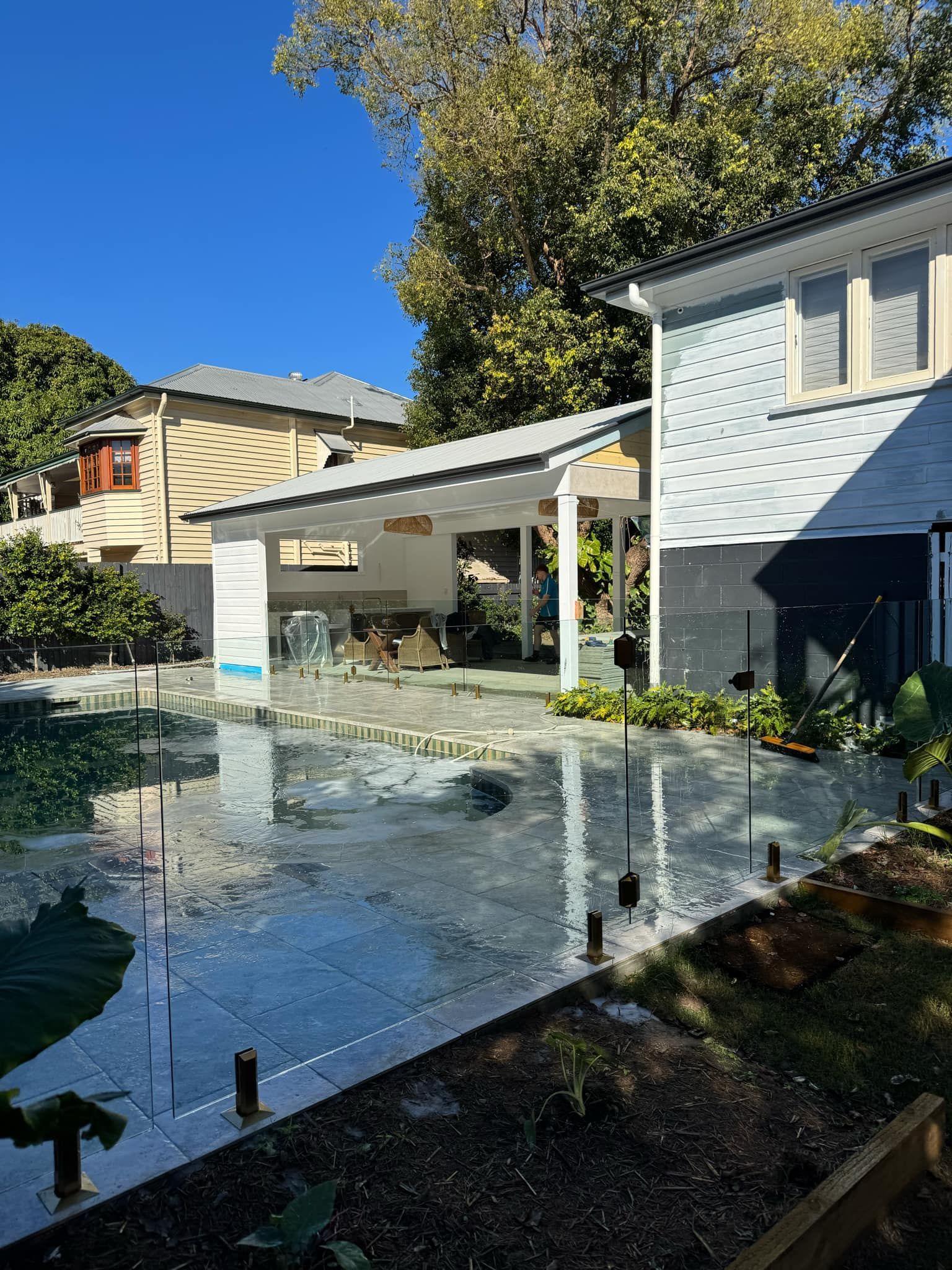 A Backyard Patio Featuring a Swimming Pool — Coastline Glass Pool Fencing in Old Bar, NSW