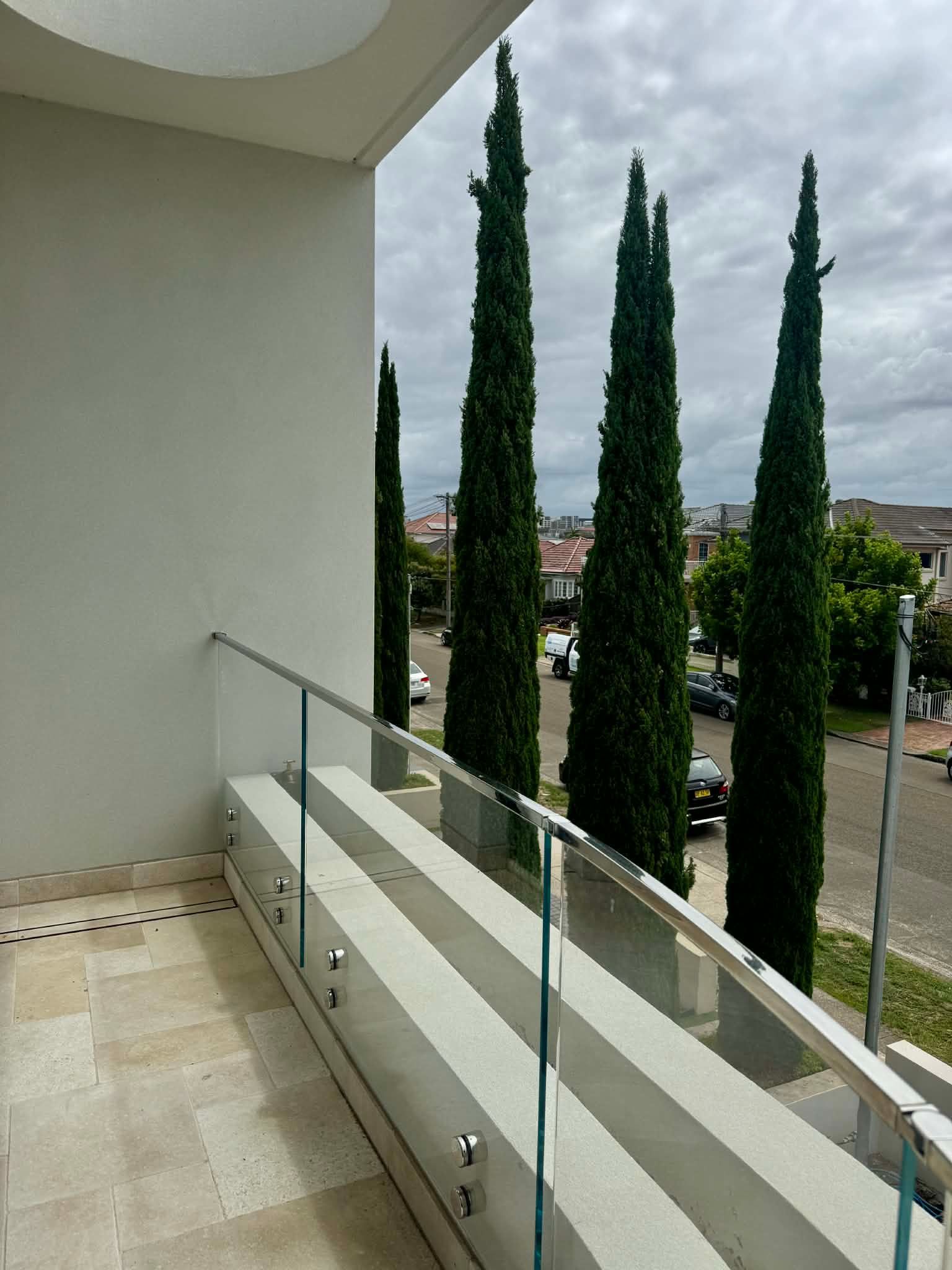 A View from A Tiled Balcony with A Glass Railing — Coastline Glass Pool Fencing in Old Bar, NSW