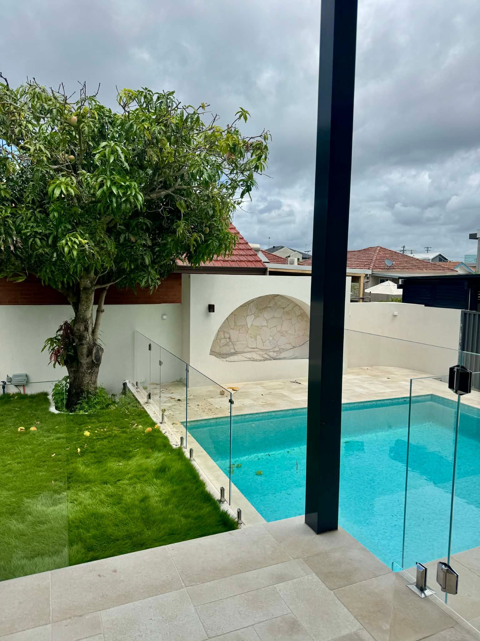 A Backyard Swimming Pool — Coastline Glass Pool Fencing in Old Bar, NSW