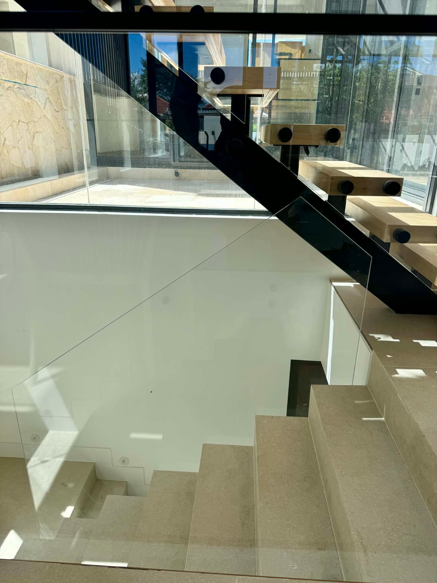 Modern Tan Stone Staircase — Coastline Glass Pool Fencing in Old Bar, NSW