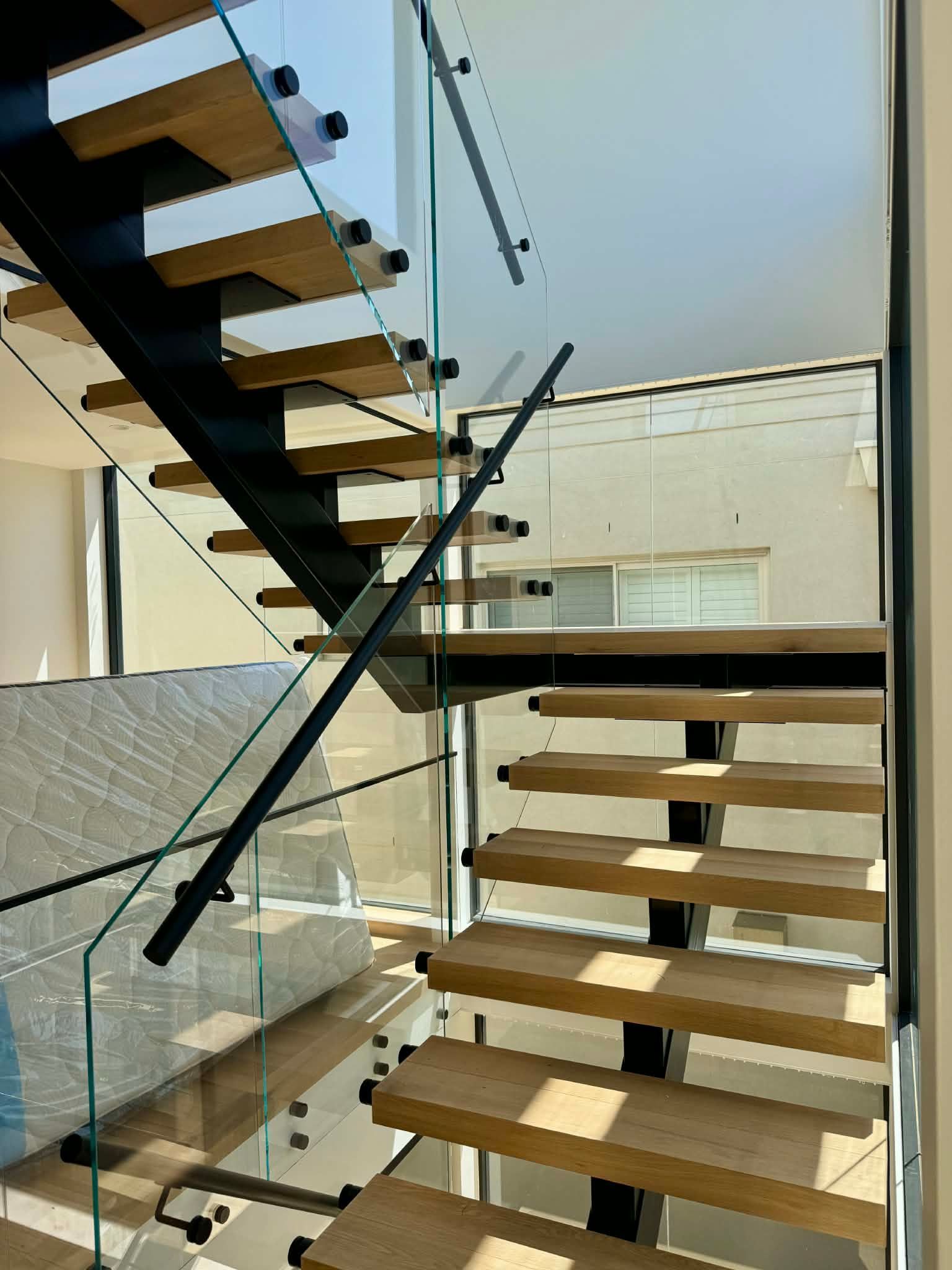 Modern Staircase with Wooden Treads — Coastline Glass Pool Fencing in Old Bar, NSW