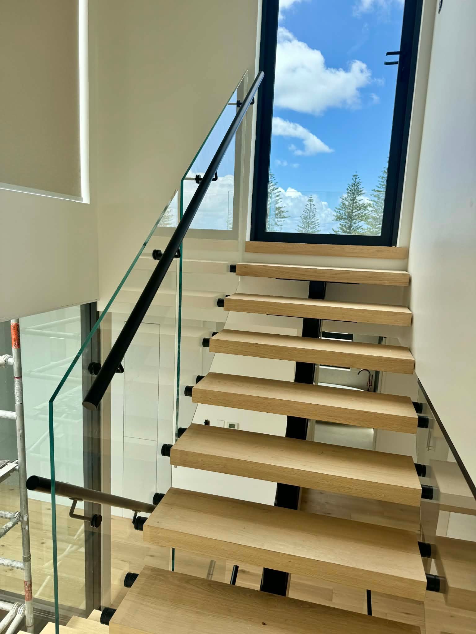 Floating Wooden Staircase with Glass Railings — Coastline Glass Pool Fencing in Old Bar, NSW
