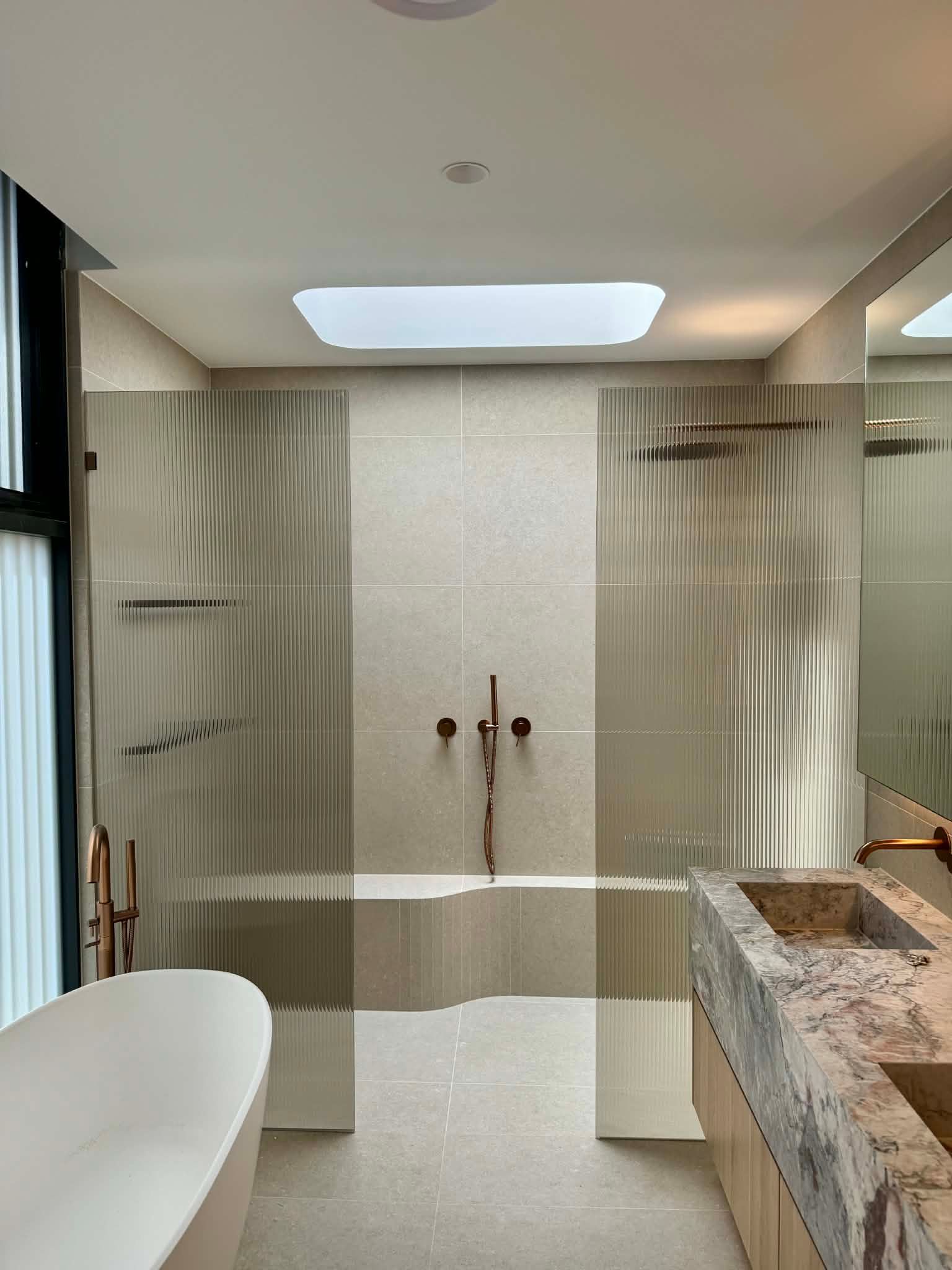 Modern Bathroom Featuring a Standalone Tub — Coastline Glass Pool Fencing in Old Bar, NSW