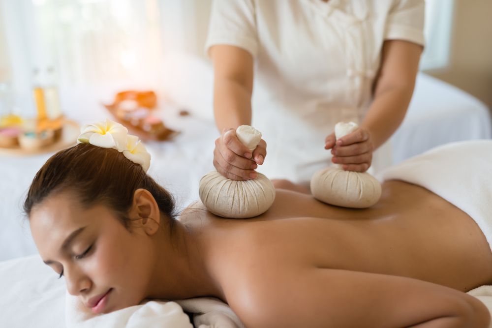 A Woman is Getting a Massage at a Spa — Siam Thai Massage In Tweed Heads, NSW