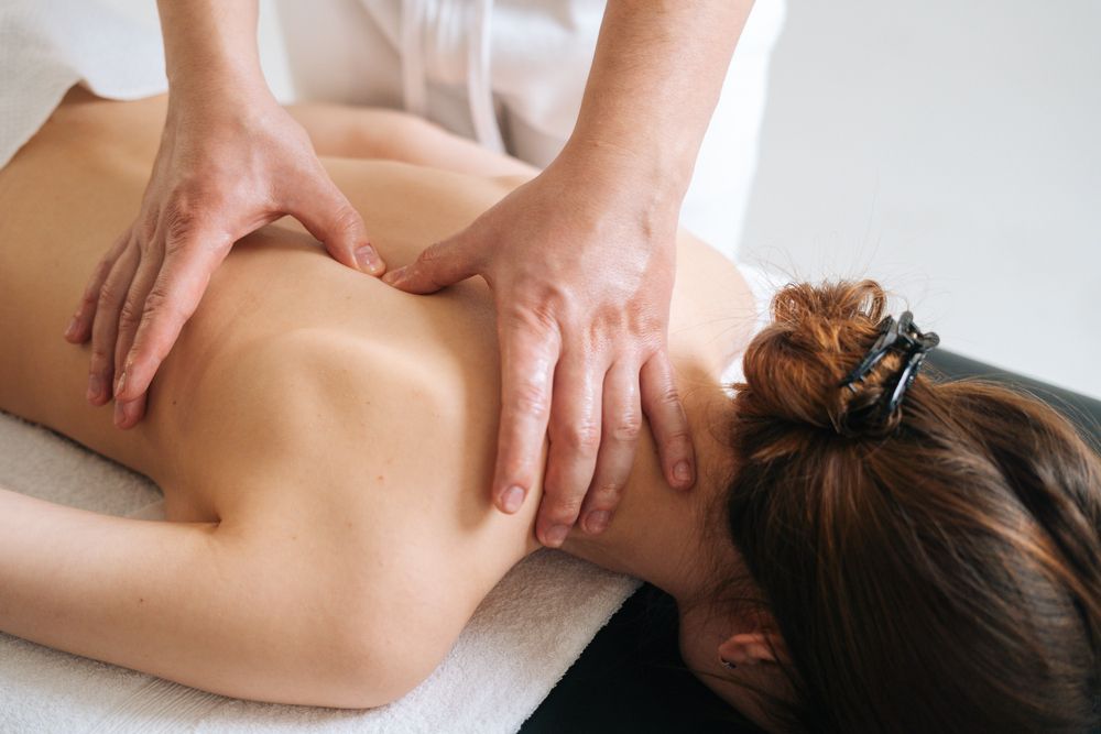 A Woman is Getting a Massage at a Spa — Siam Thai Massage In Tweed Heads, NSW