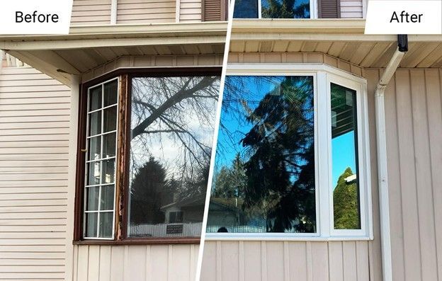 A side-by-side comparison of a bay window showing old, damaged wood frames on the left and new, white frames on the right.