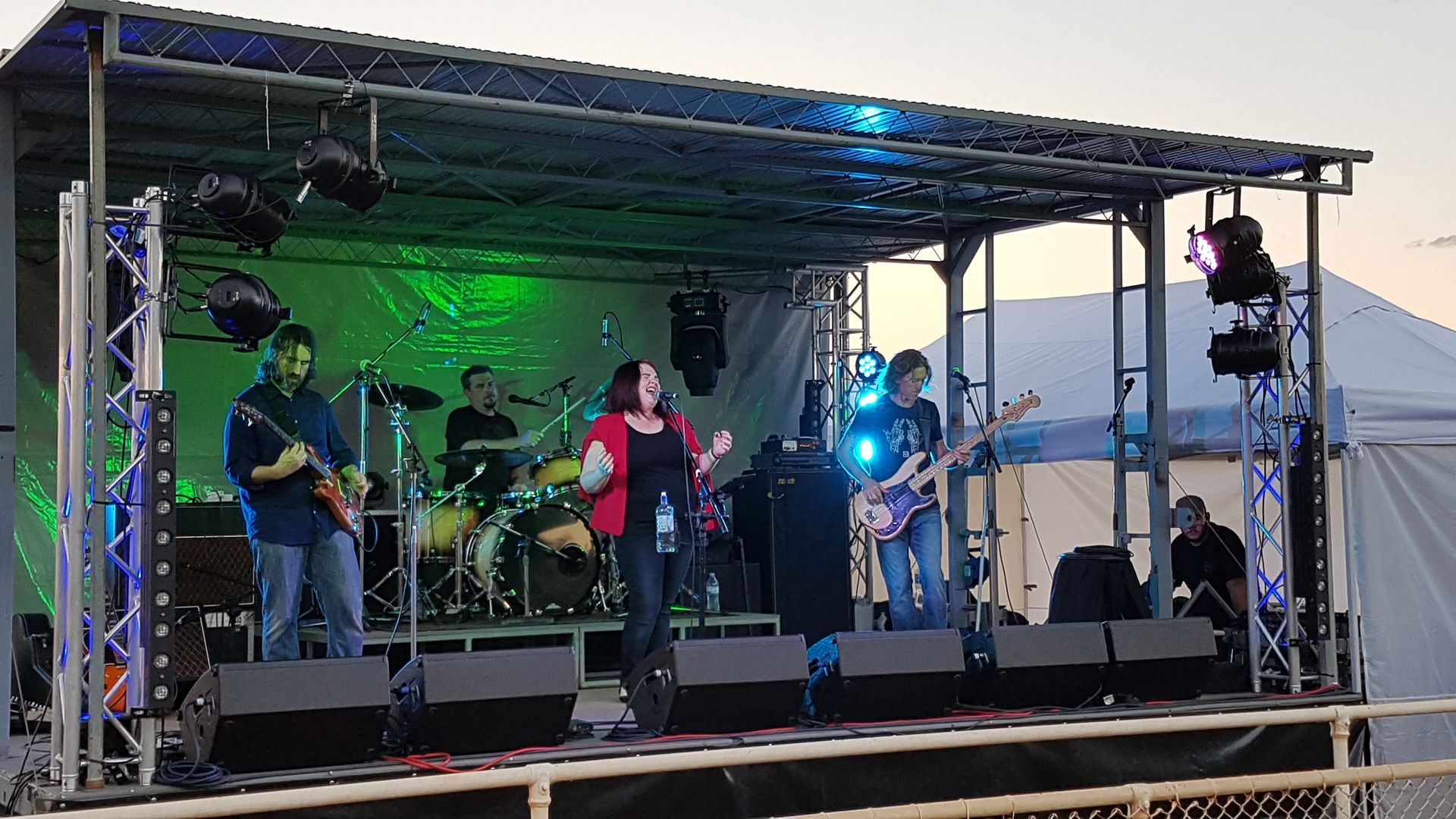 A group of people are playing instruments on a stage.