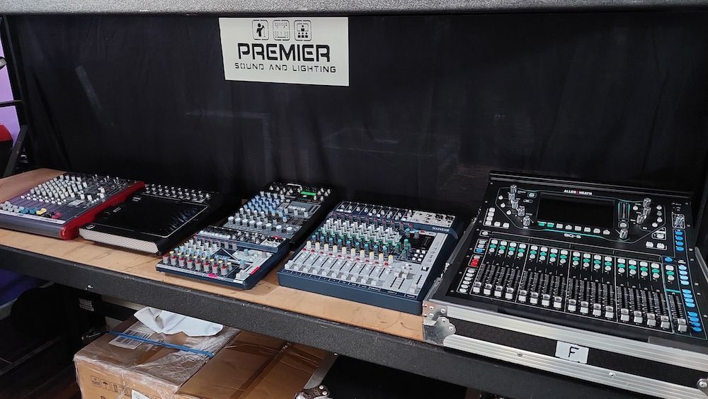 A row of mixers on a shelf with a sign that says premier on it.