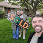 Three people holding a 