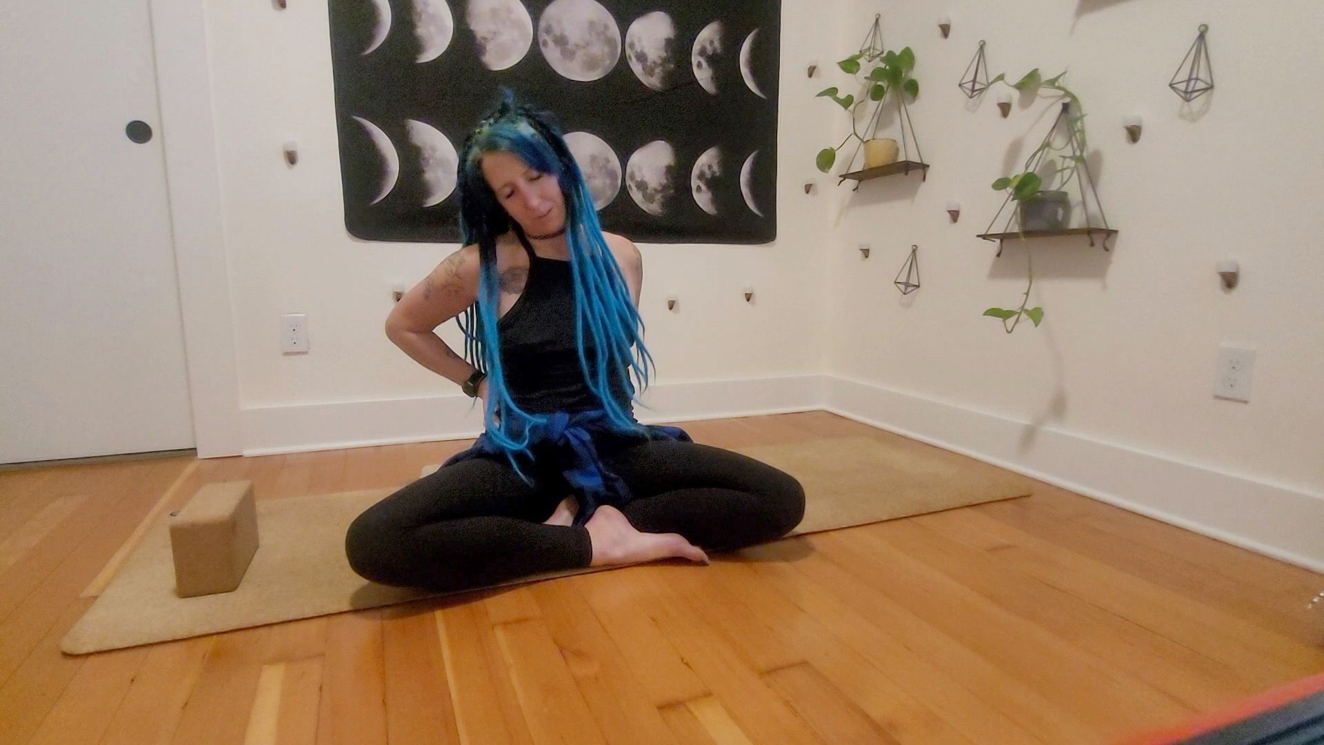 April sitting on the mat doing neck stretches