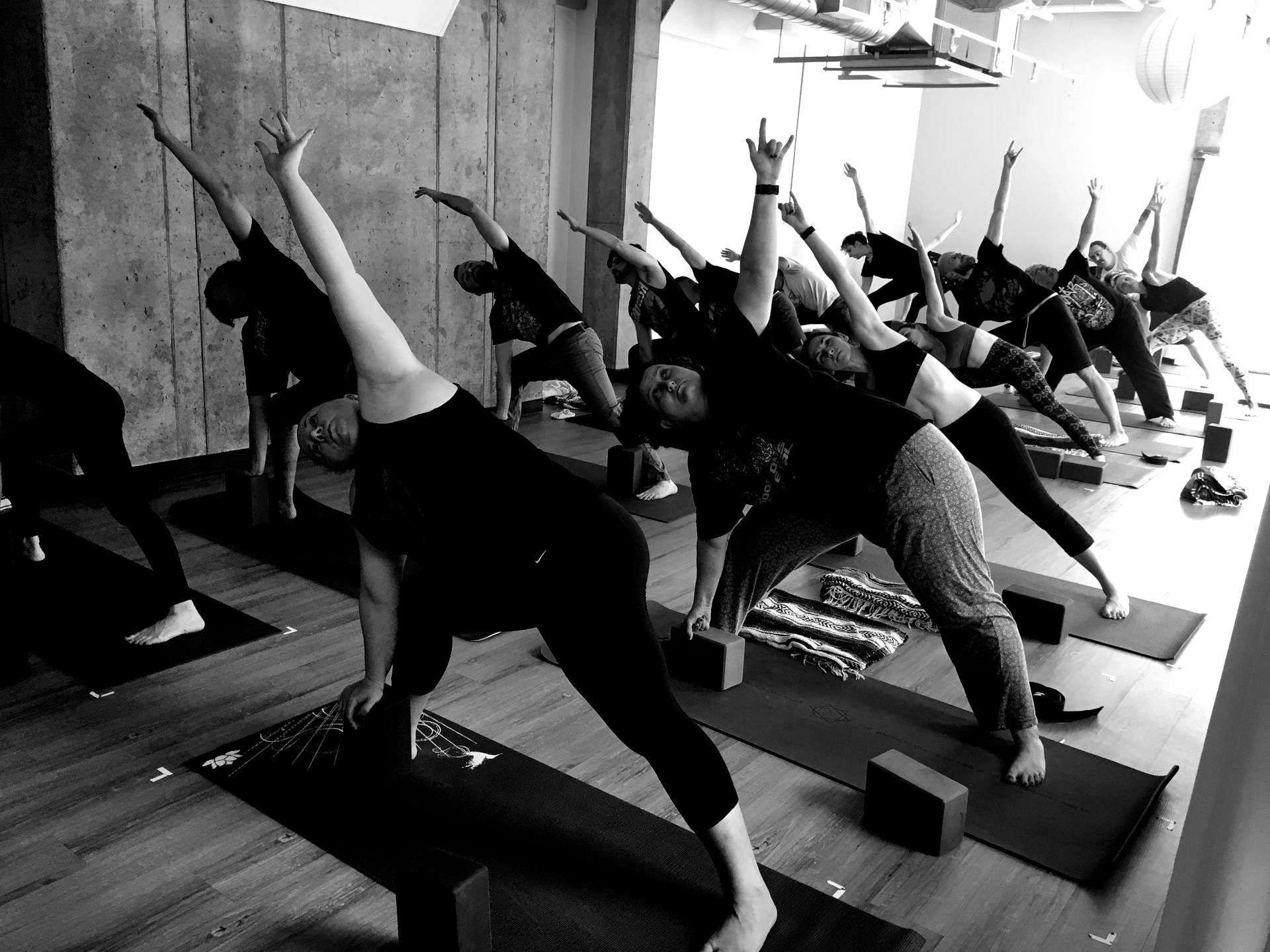 black and white group shot of doom metal yoga class