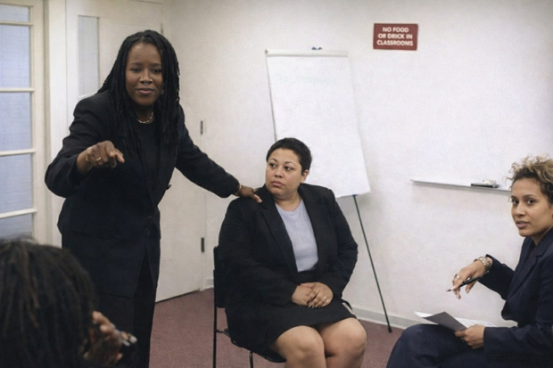 Dr. Renaya talking to a group of people.

